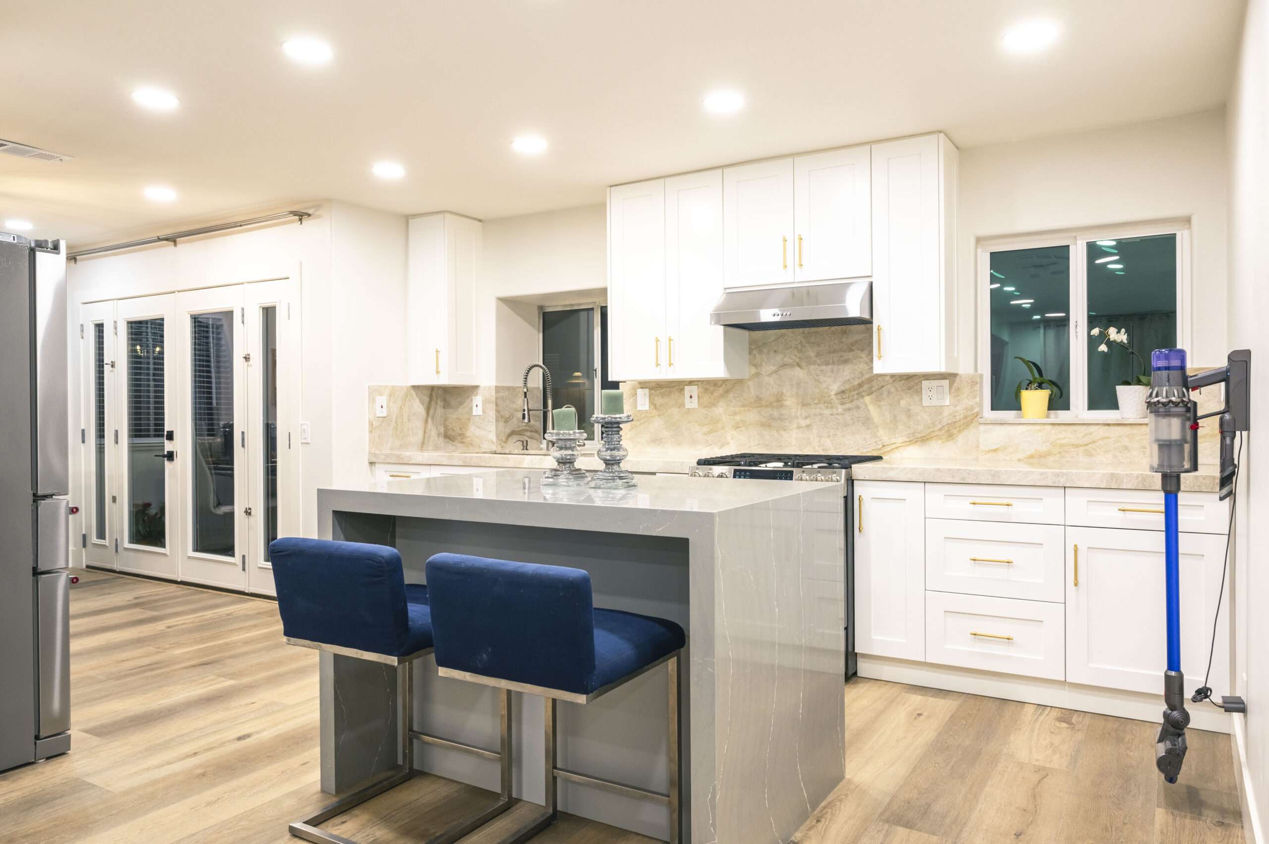 Completed Mission Viejo kitchen remodel with white shaker cabinets and waterfall island
