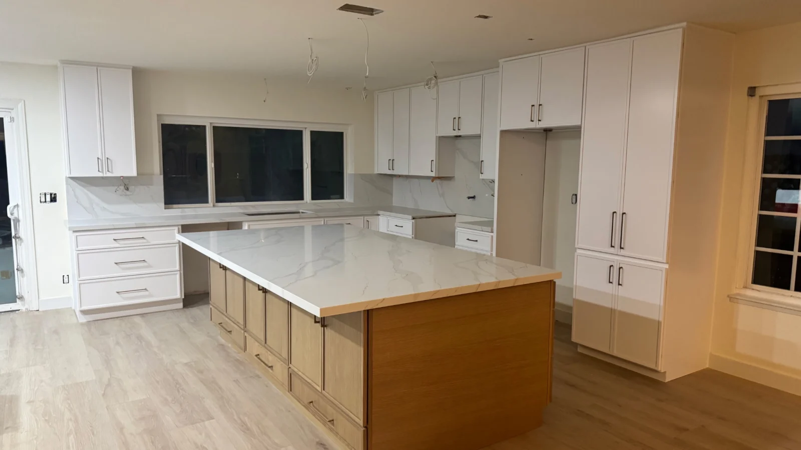 Kitchen remodel during cabinet installation before countertops